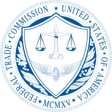 Federal Trad Commission logo. White round logo with navy blue letters. Inside the round logo is an image of the scales of justice.